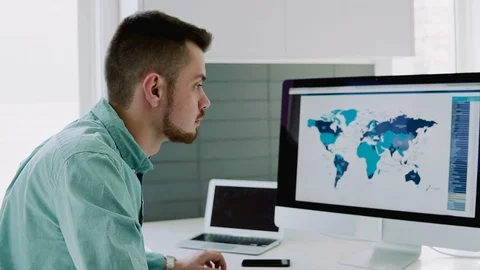 Creative designer works for a large computer at home and holds records Stock Footage 104322079