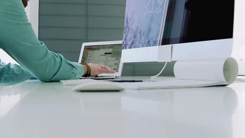 Creative designer works for a large computer Stock Footage 104322086