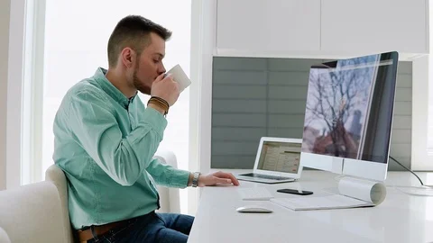 Creative designer works for a large computer Stock Footage 104322106