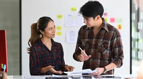 Creative designers are working together to developing mobile responsive website Stock Photos