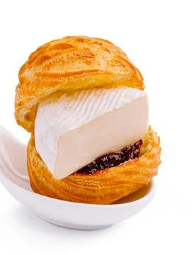 Creative dessert featuring puff pastry with cream and fruit jam Stock Photos