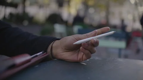 Creative digital art session with pen tablet in outdoor urban environment Stock Footage 312582393