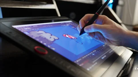 A creative digital artist animator using a touch pen drawing tablet and 3D Stock Footage 141398115