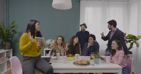 Creative director discusses new idea with colleagues for advertising campaign Stock Footage 122215108