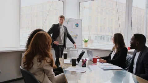 Creative director team lead clap hand with designer team at meeting table Stock Footage
