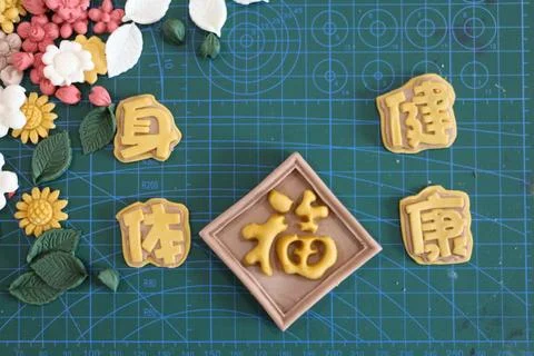 Creative display of handmade polymer clay decorations featuring traditional.. Stock Photos