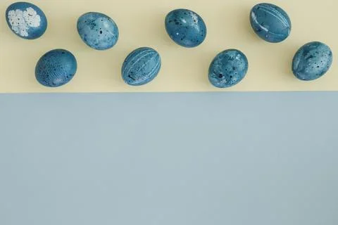 Creative Easter background with Easter eggs in blue tones. Copy space, top view Stock Photos