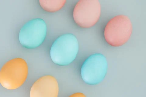 Creative Easter background with pastel colored Easter eggs Stock Photos