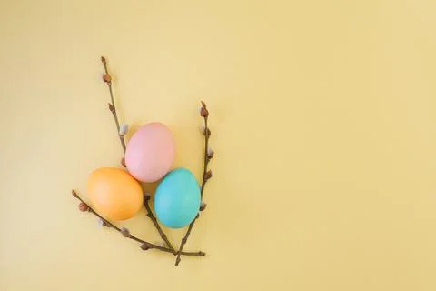 Creative easter bouquet of pussy willow branches and easter eggs in pastel Stock Photos