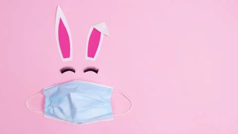 Creative Easter bunny with face mask blinking with eye lashes. Stop motion Stock Footage 150071180