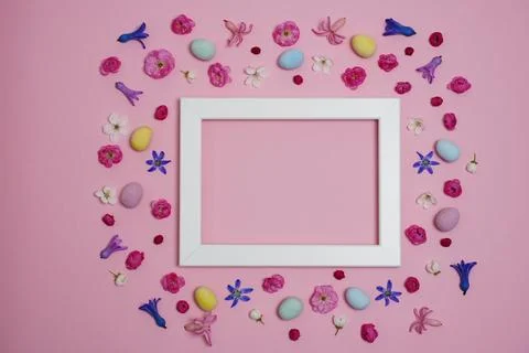 Creative Easter composition with Easter eggs, spring flowers and buds Stock Photos