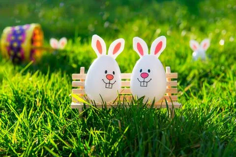 Creative Easter composition of Funny Easter eggs with bunny ears sitting on Stock Photos