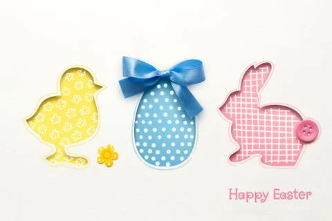 Creative easter concept photo of chicken egg and rabbit made of paper on white b Stock Photos