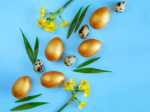 Creative Easter diagonal composition made from golden wooden eggs, quail eggs Stock Photos