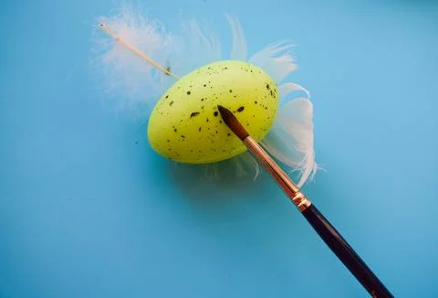 Creative Easter Egg Painting with Green Egg and Feathers, Flat Lay Stock Photos