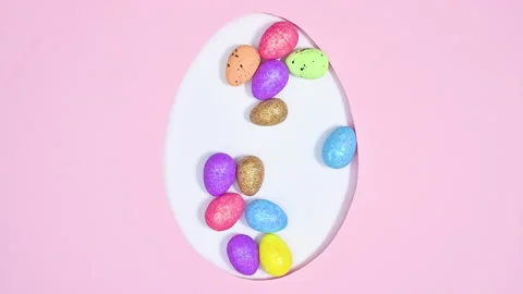 Creative Easter egg shape filling with colorful eggs. Stop motion flat lay 스톡 동영상 171361863