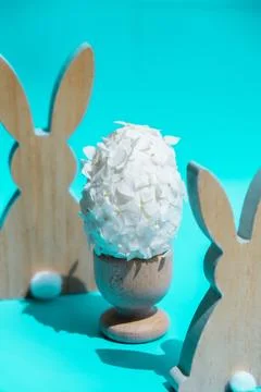Creative Easter egg shape made of white lilac spring petals flowers. Responsible Stock Photos