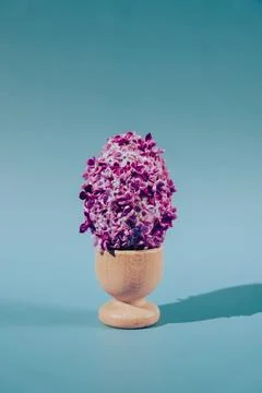 Creative Easter egg shape made of lilac spring petals flowers. Minimal holiday 스톡 사진