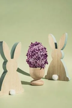 Creative Easter egg shape made of lilac spring petals flowers. Eco-friendly Stock Photos
