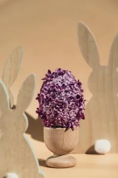 Creative Easter egg shape made of lilac spring petals flowers. Eco-friendly Stock Photos