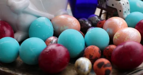 Creative Easter eggs centerpiece featuring step of egg painting process with Stock Footage 306066261