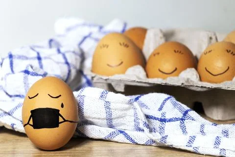 Creative Easter eggs with Corona virus protection, egg in a black mask Stock Photos