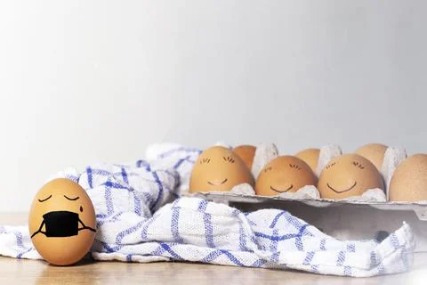 Creative Easter eggs with Corona virus protection, egg in a black mask in a q Stock Photos