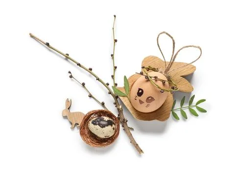 Creative Easter eggs with nest and branch isolated on white background Stock Photos