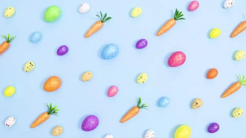 Creative Easter vibrant pattern made of eggs and carrots. Stop motion Stock Footage 149932420