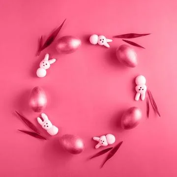 Creative Easter wreath made from wooden eggs, marshmallow bunny and grass on Stock Photos