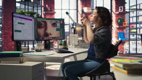 Creative editor uses design software and photography tools to develop content Stock Footage 308673778