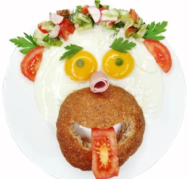 Creative egg breakfast for child face form Stock Photos