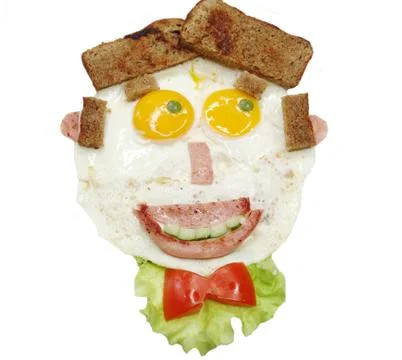 Creative egg breakfast for child face form Stock Photos