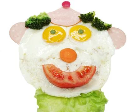 Creative egg breakfast for child face form Stock Photos