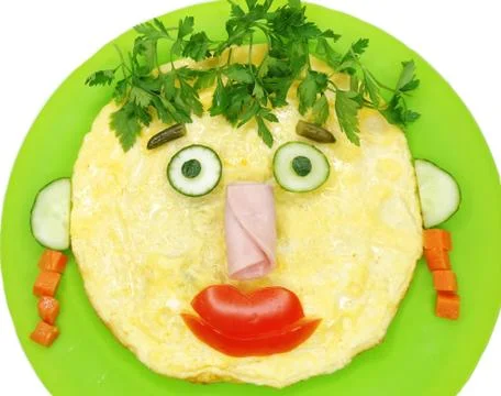 Creative egg breakfast for child face form Stock Photos