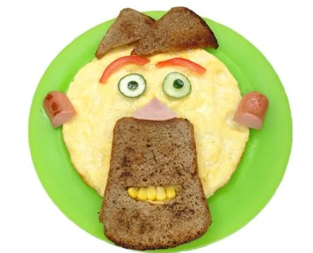 Creative egg breakfast for child face form Stock Photos