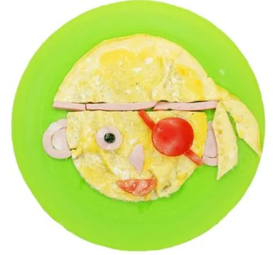 Creative egg breakfast for child face form Stock Photos