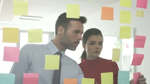 Creative employees working with sticky notes at office Stock Footage 73669800