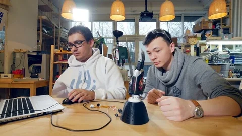 Creative engineers team at modern start up office working with innovative bionic Stock Footage 72985103