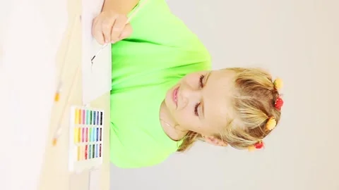 Creative expression shines through a young artist's vibrant watercolor journey Video stock 296332801