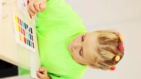 Creative expression unfolds in vibrant colors during art session 스톡 동영상 296332750