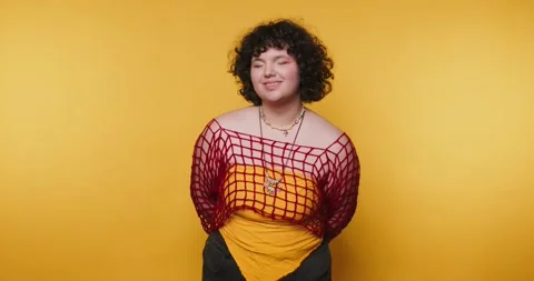 Creative expression in vibrant colors with a confident individual posing ag.. Stock Footage 313951589