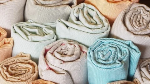 Creative fabric rolls displayed in an organized manner Stock Footage 311971891