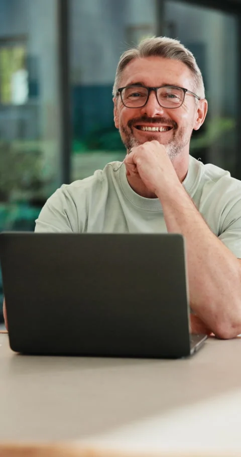 Creative, face and man with laptop in house, happy and editing fiction novel on Stock Footage 335875211