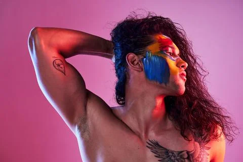 Creative, face paint and art with man in studio for beauty, self love and Stock Photos