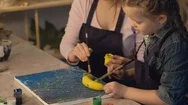 Creative Family Mother Daughter Painting Banana Stock Footage