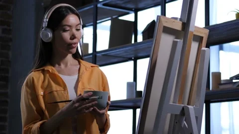 Creative female painter drawing artwork at studio Video stock 103474458
