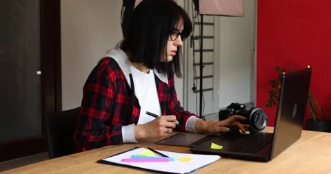 Creative female photographer, using graphic drawing tablet and stylus pen Stock Footage 153578544