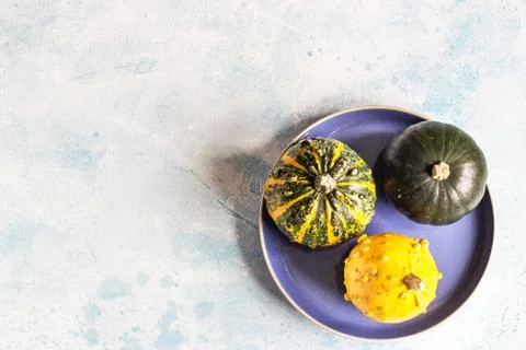 Creative flat lay autumn composition with decorative pumpkins. Stock Photos