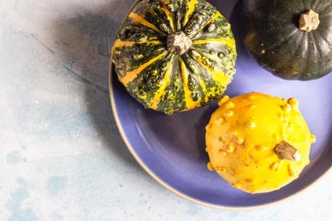 Creative flat lay autumn composition with decorative pumpkins. Stock Photos